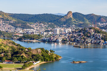 Fototapeta premium View of the city of Vitória, capital of Espírito Santo, during a beautiful morning with sunshine and blue sea. View from the Penha Convent, in Vila Velha.