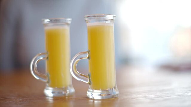 Two vitamin ginger immunity shots on table