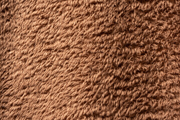 Texture of a brown faux fur as a background.