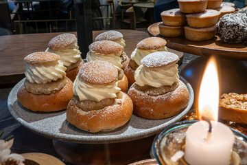 Obraz na płótnie Canvas Stockholm, Sweden Semlor pastries for sale in a bakeshop.