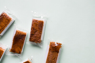 Cakes individually wrapped in plastic packaging, unsustainable product packaging, mini cakes in plastic wrappers wasteful and bad for the environment