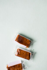 Cakes individually wrapped in plastic packaging, unsustainable product packaging, mini cakes in...