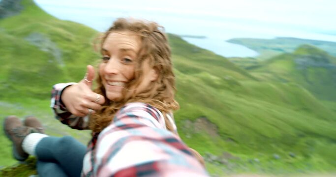 Live stream, hiking and face of woman in mountain with travel blog, adventure and vacation. Photography, trekking and girl in selfie on holiday journey in nature with social media memory on cliff.