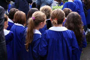 Female pupils of the Italian primary school with blue aprons