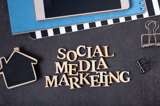 Social Media Marketing inscription made with wooden letters, top view on dark background