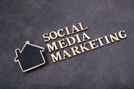 Social Media Marketing inscription made with wooden letters, top view on dark background.