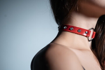 young woman in red leather bdsm collar with metallic ring, female in seductive role playing game sexy choker - obrazy, fototapety, plakaty