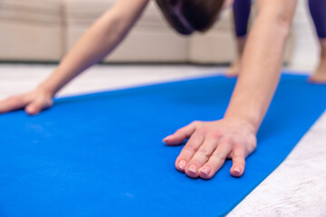 Young woman standing in downward dog pose