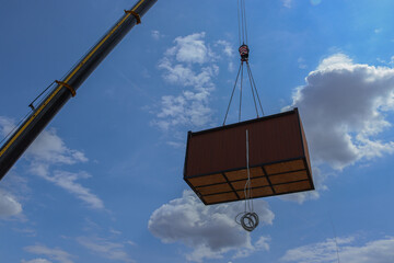 Prefabricated home (modular house, prefab house, container) installation with a big construction...