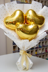 bouquet of gold foil hearts, heart balloons in a bouquet