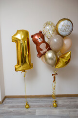set of gold balloons with foil number, 1 year old balloons, brown bear
