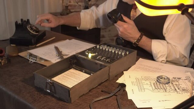 enigma scientist dials phone and talks while decoding the machine