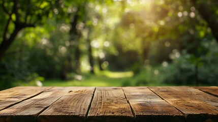 wooden table and blurred green background  - obrazy, fototapety, plakaty