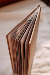 The image is a close-up shot of a book, showcasing its details like the binding and pages 6171.