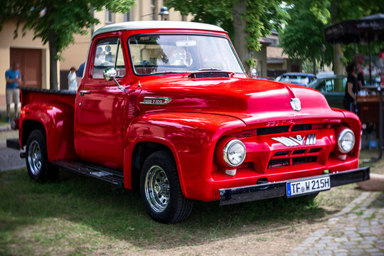 WERDER (HAVEL), GERMANY - MAY 20, 2023: Full-size pickup truck Ford F-100. Swirl bokeh. Art lens. Oldtimer - Festival Werder Classics 2023