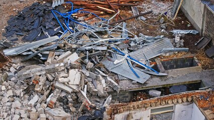 Pieces of Metal Support Beam Cinder Block Reinforced Concrete Rubble and Construction Waste at Old Building Demolition Site