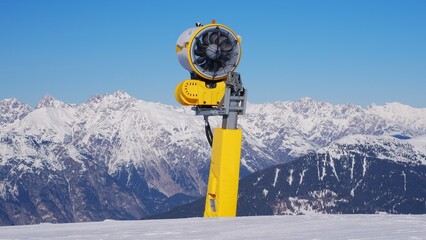 Snow Cannon Artificial Snowmaking Machine In Standby Mode at Ski Resort Slope in Austrian Alps...
