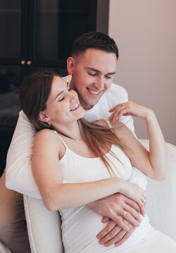 pregnant woman and husband at home