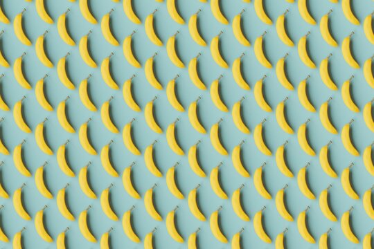 Many bananas on cadet blue background. Top flat view, diagonal grid. 3d render, illustration