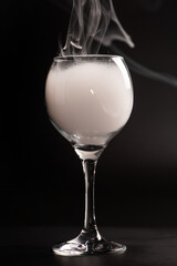 Crystal glass, beautiful Crystal glass with smoke on black background, selective focus.