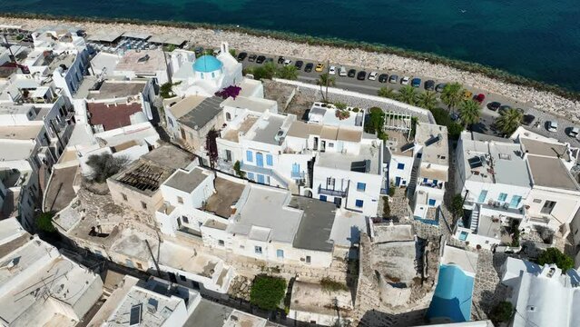 Aerial drone video from traditional settlement and Frankish Castle of Paroikia with unique Cycladic architecture, Paros island, Cyclades, Greece