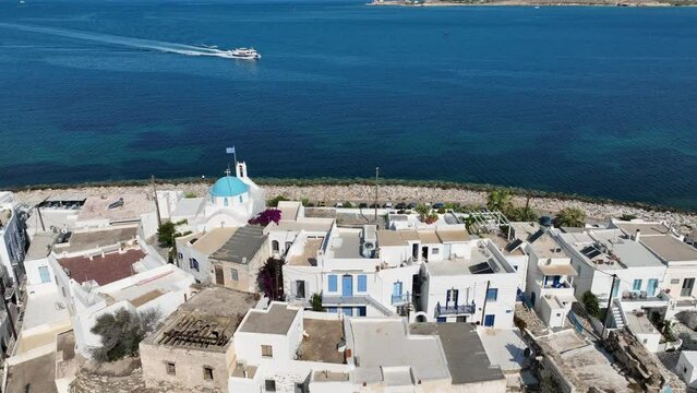 Aerial drone video from traditional settlement and Frankish Castle of Paroikia with unique Cycladic architecture, Paros island, Cyclades, Greece