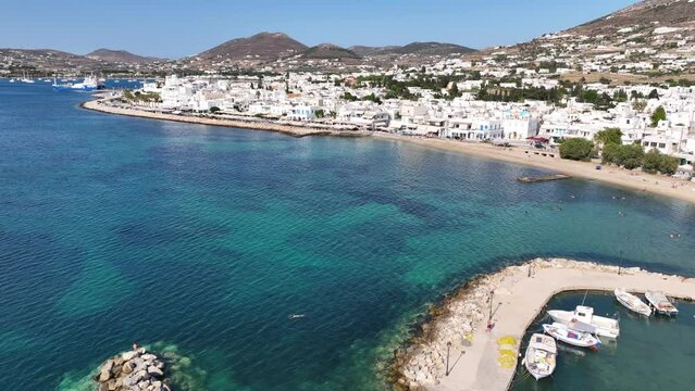 Aerial drone video of traditional settlement of Paroikia with unique Cycladic architecture, Paros island, Cyclades, Greece