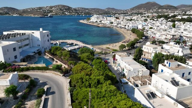 Aerial drone video of traditional settlement of Paroikia with unique Cycladic architecture, Paros island, Cyclades, Greece
