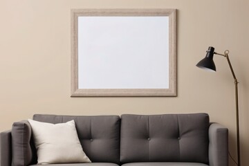 A mockup of a blank picture frame on the wall in a contemporary style living room