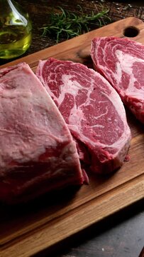 chunk of ribeye steak on wooden board