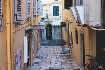 Obraz na płótnie Canvas Corfu street view, Kerkyra old town beautiful cityscape, Ionian sea Islands, Greece, a summer sunny day, pedestrian streets with shops and cafes, architecture of historic center, travel to Greece