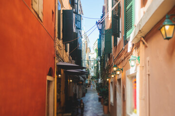Corfu street view, Kerkyra old town beautiful cityscape, Ionian sea Islands, Greece, a summer sunny day, pedestrian streets with shops and cafes, architecture of historic center, travel to Greece - obrazy, fototapety, plakaty