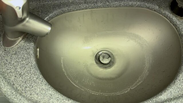 Old wash basin inside the bathroom of a Boeing 737-800 aircraft