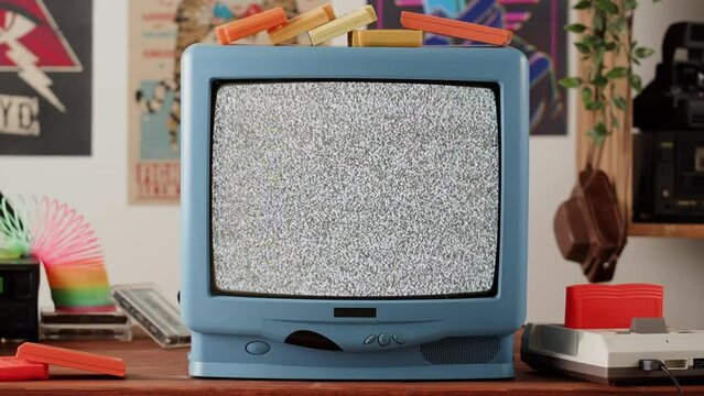 Old television with gray screen at home. Close-up of vintage tv in living room, nostalgia. Searching channel, bad signal. 