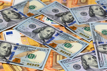 50 euro and 100 dollar bills scattered on the table as a background 17
