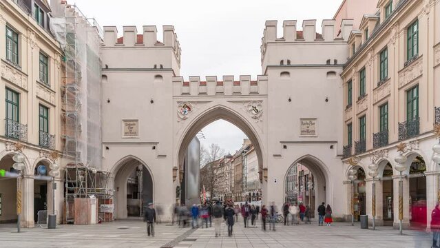 Karlstor in the old town of Munich timelapse with unidentified people walking on the street. The Karlstor is the western city gate of the historic old town. Entrance to Kaufingerstrasse. Germany