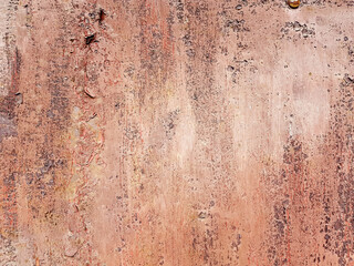 Rusted metal background with streaks of rust.