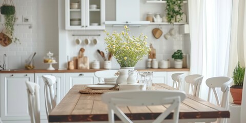 Kitchen interior details. Cozy farmhouse style kitchen interior with wooden table and white classic furniture