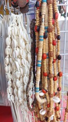 Colorful bracelets made of beads and ropes for sale at the market