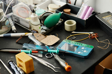 different equipment and tools for diagnostics of electronic devices in workshop, repair business