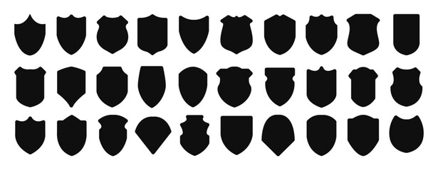 Set of silhouette icons of shields. Military shield insignia of different shapes. Vector elements. - obrazy, fototapety, plakaty