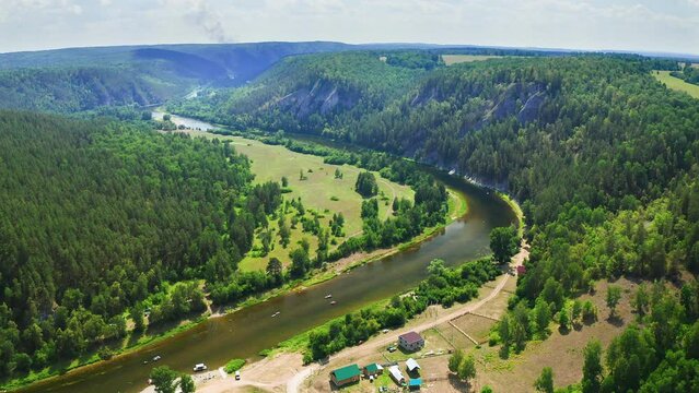 4k aerial footage of a river in Ural mountains landscape. Famous Agidel river in Bashkortostan. Rafting season on a river in summer
