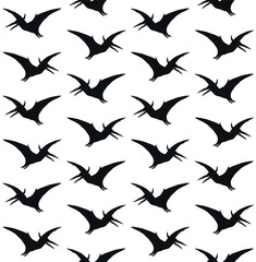 Vector seamless pattern of flat hand drawn pterodactyl dinosaur silhouette isolated on white background © Sweta