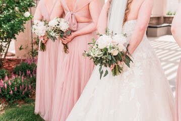 Bouquets behind backs