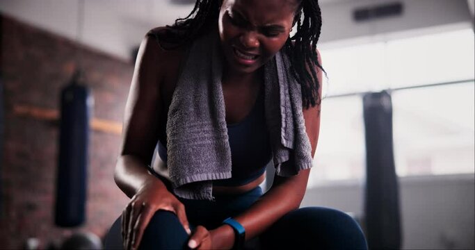 Knee pain, stress and black woman at a gym with fitness training accident, mistake or anatomy emergency. Leg, injury and lady athlete with muscle, tension or joint inflammation from body workout