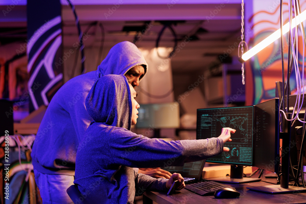 Poster hacker sharing ideas about breaking into government server, showing criminal ransomware code on scre