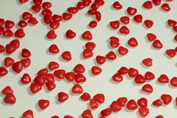several litlle hearts on the white table