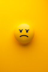 Fototapeta premium Sad emoji on a yellow background