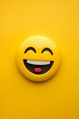Fototapeta premium Happy emoji on a yellow background