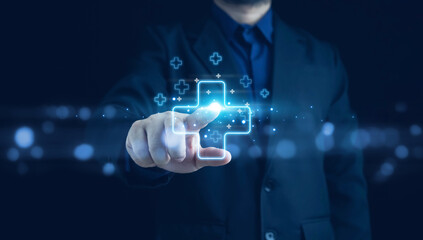 Businessman holding virtual blue plus sign for positive thinking mindset or healthcare insurance symbol concept, Mental health care, mental rejuvenation.